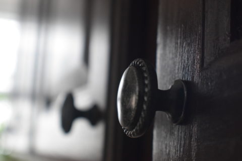 cabinet knob close up in dim light