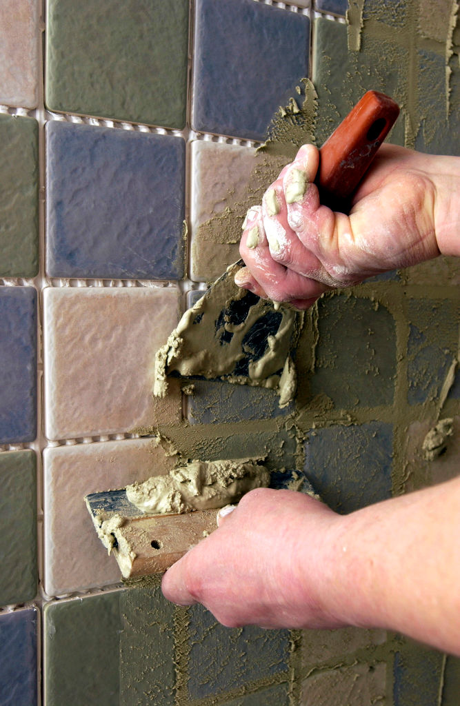 Apply grout upwards on vertical tiles.