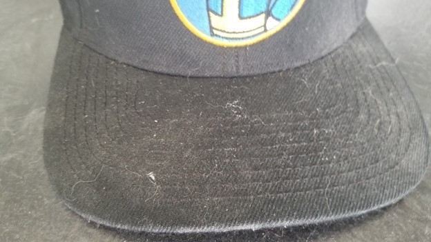front brim of black baseball cap