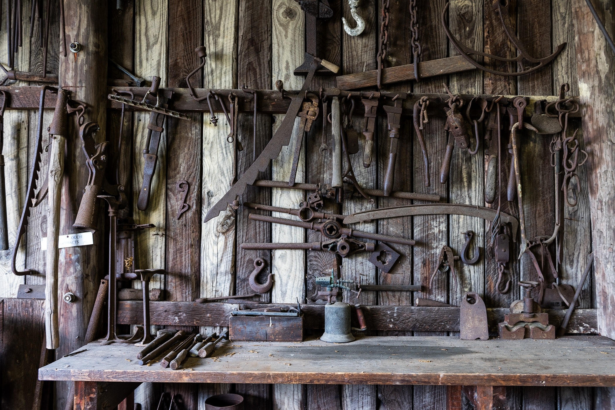 Old and rustic tool wall of metal tools. 