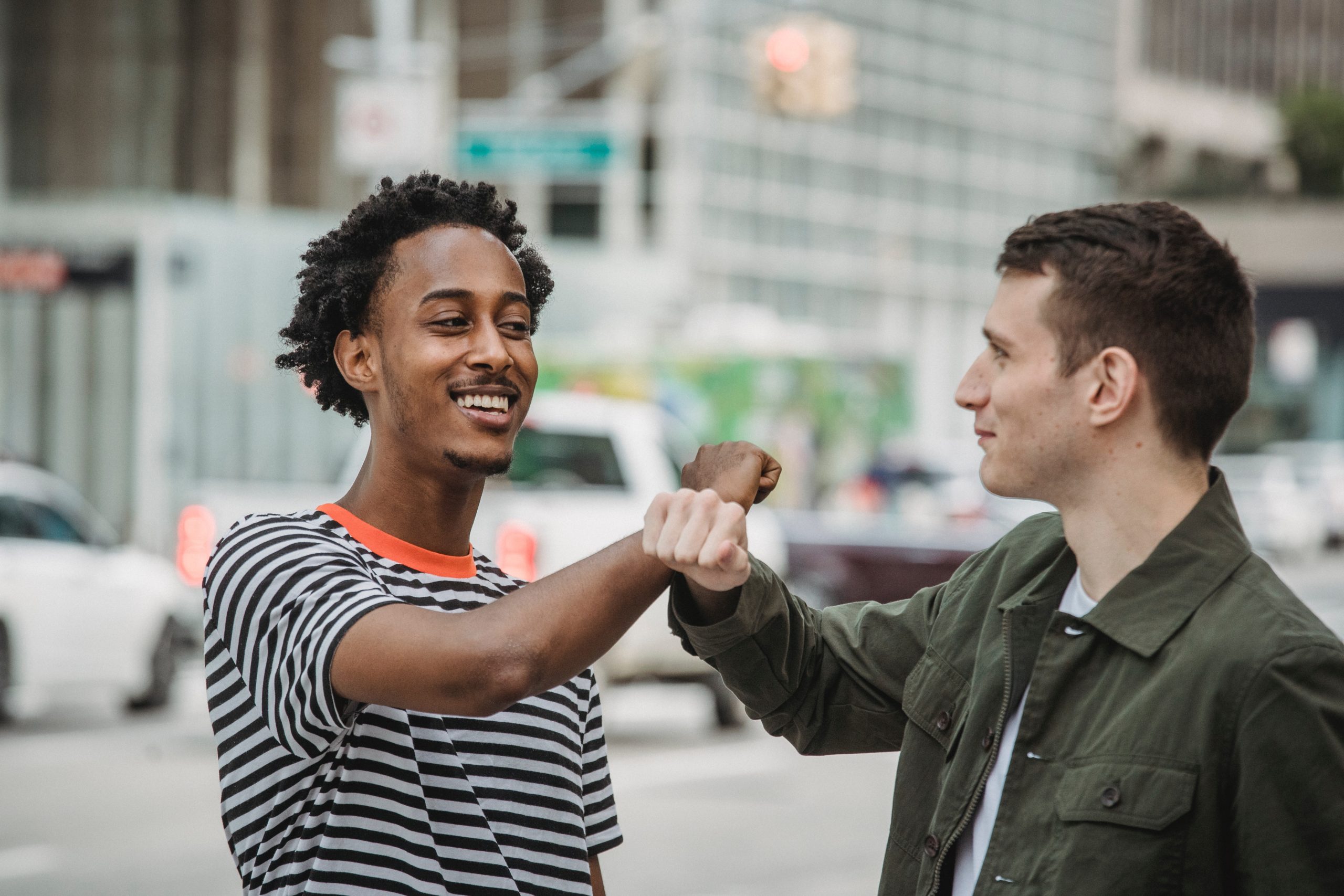 two men fist bumping