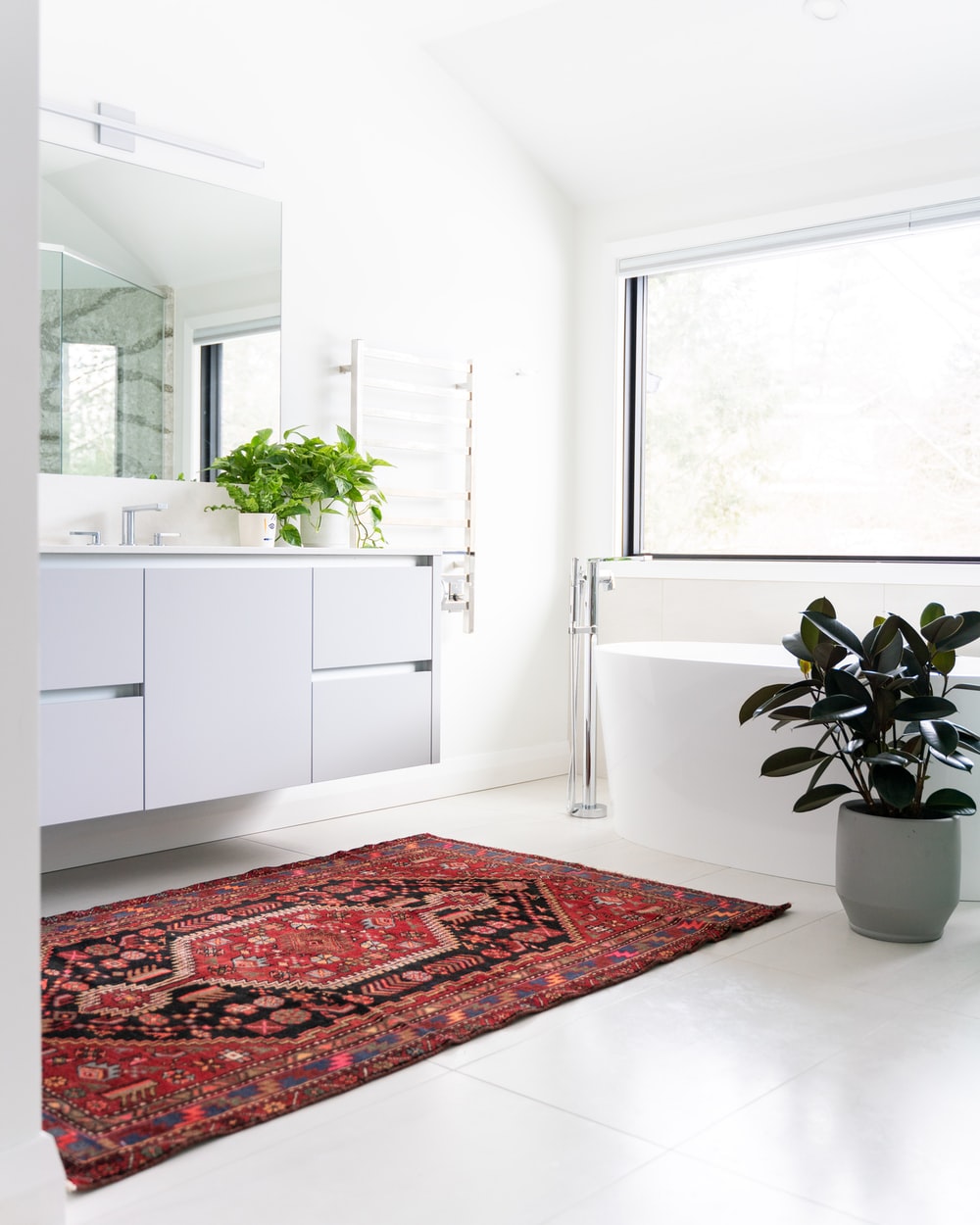 all white bathroom with potted plant