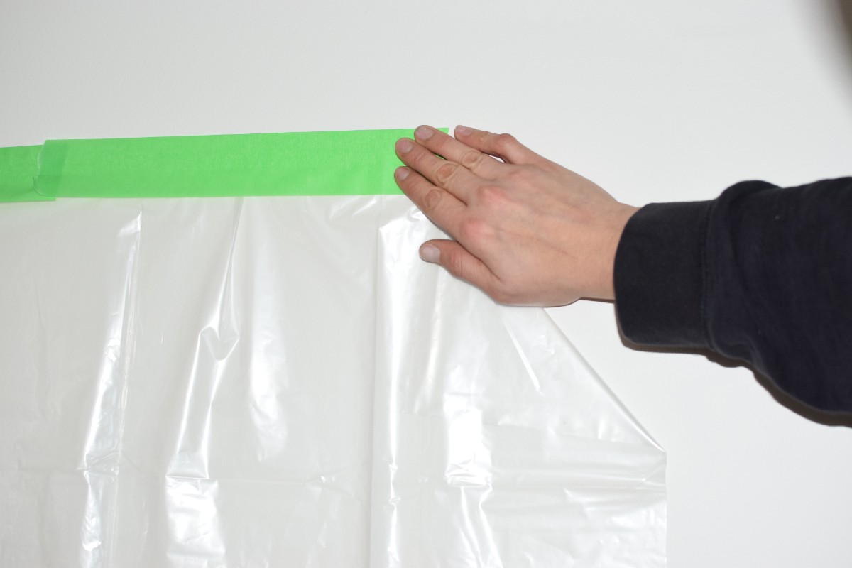 using painters tape to secure a drop cloth