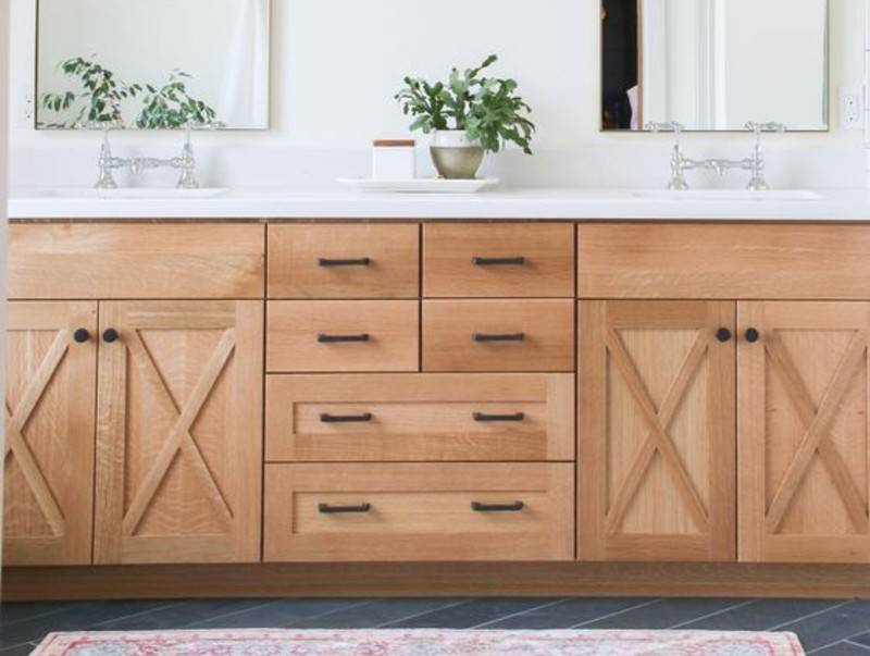 wooden bathroom cabinets with black hardware