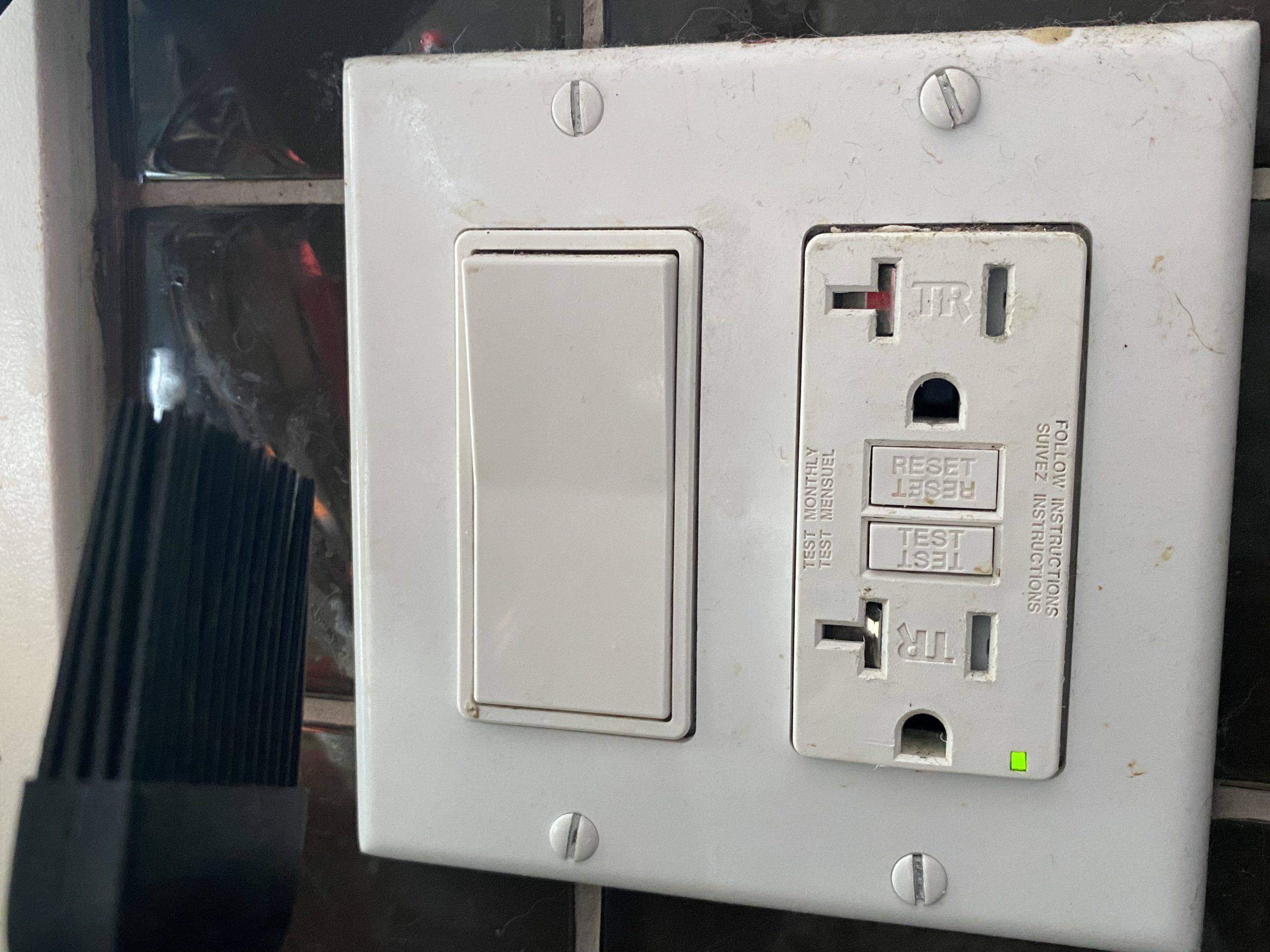 gfci outlet with test and reset button visible