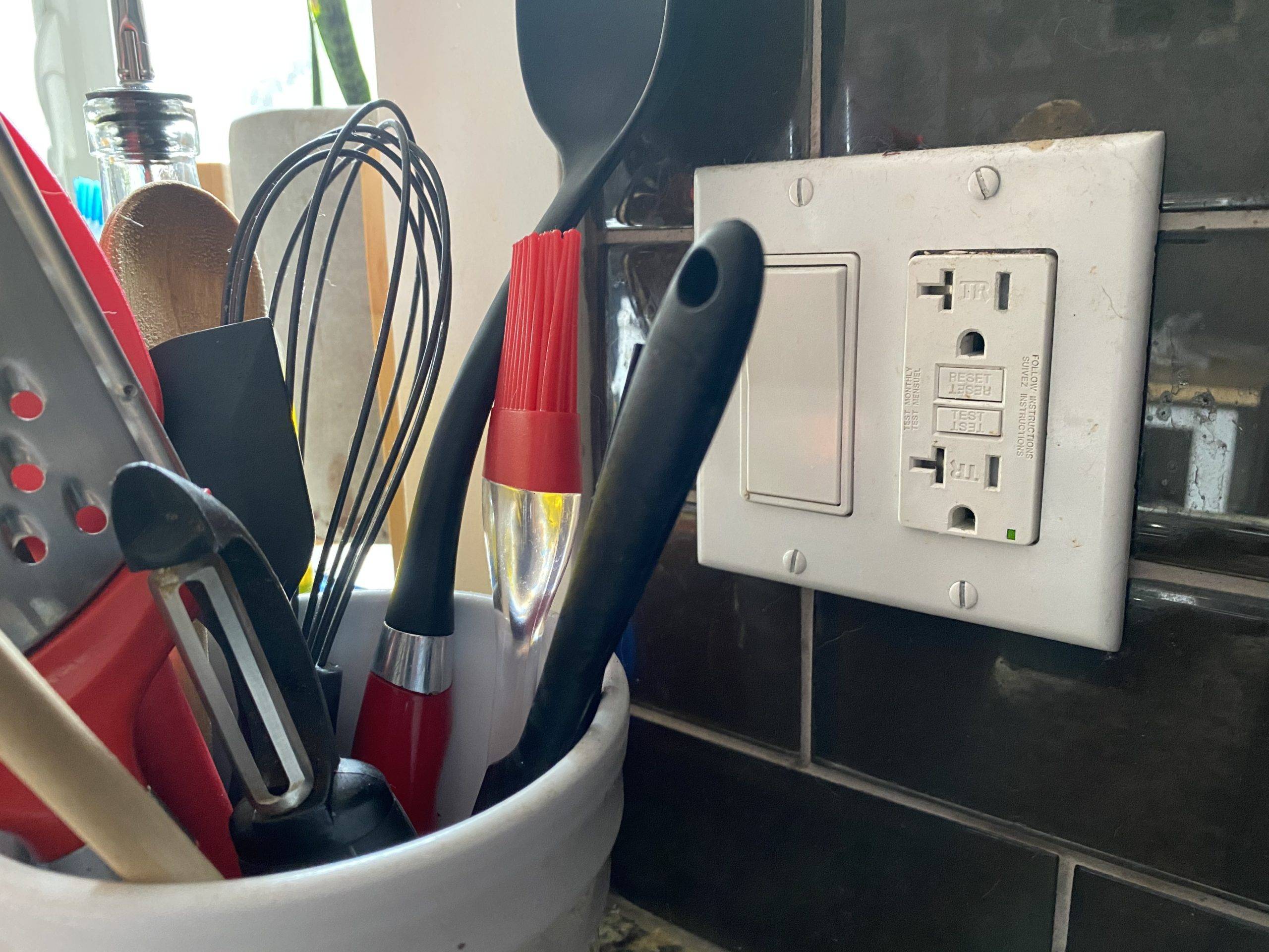 gfci outlet near kitchen utensils