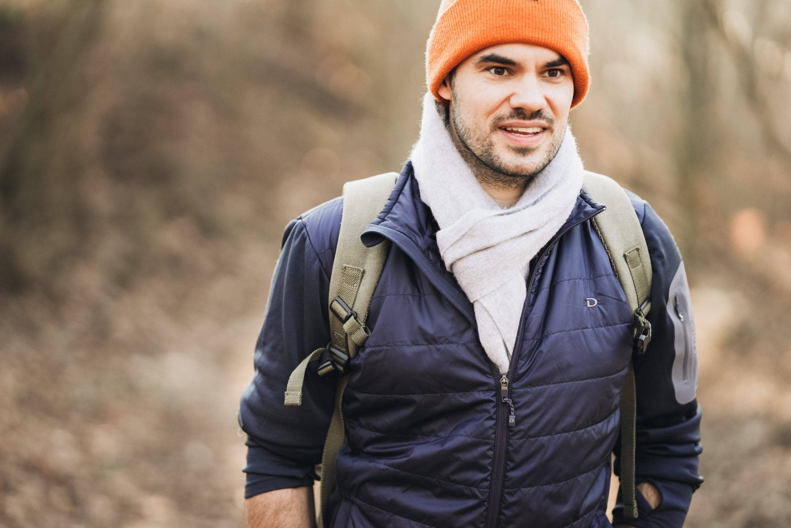 Man with orange toque hiking