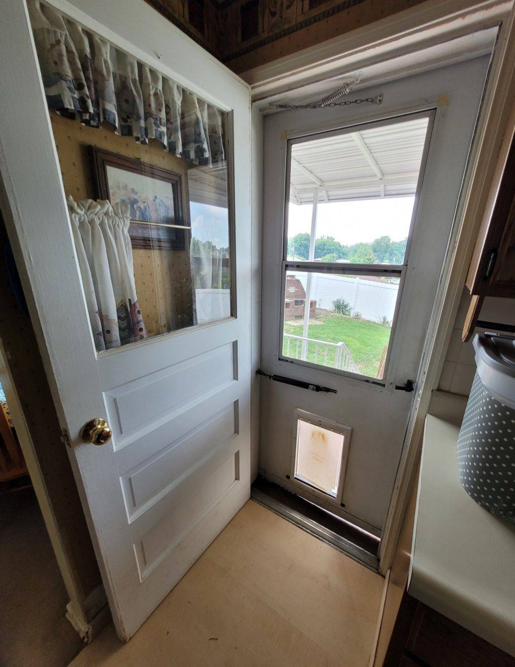 interior door opening to exterior storm door