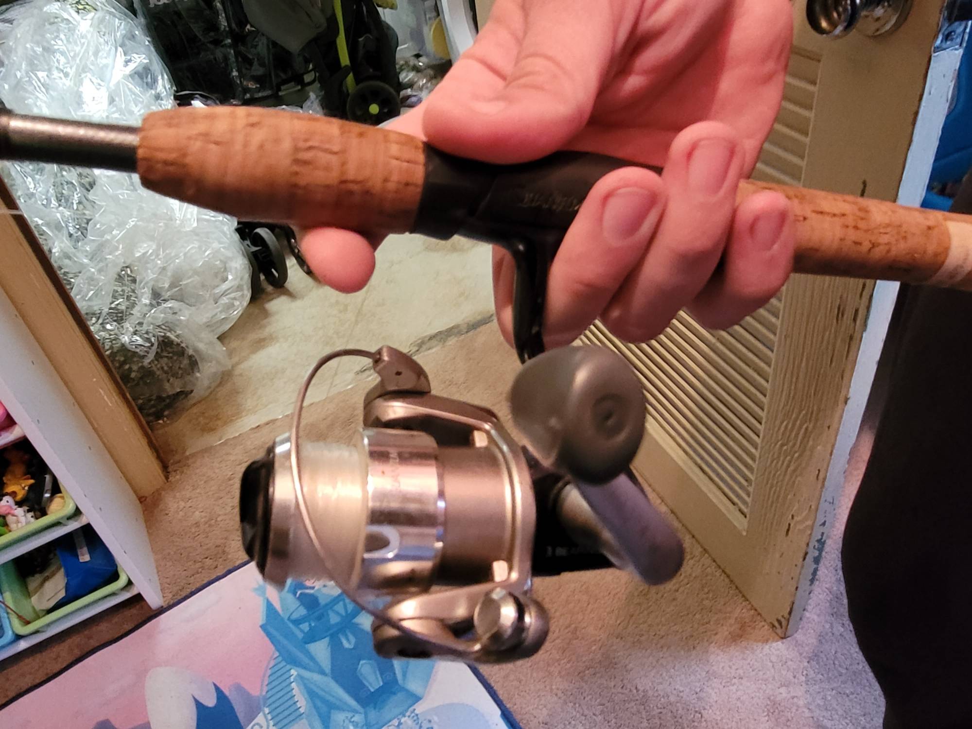 hand demonstrating one-hand cast on spinning reel