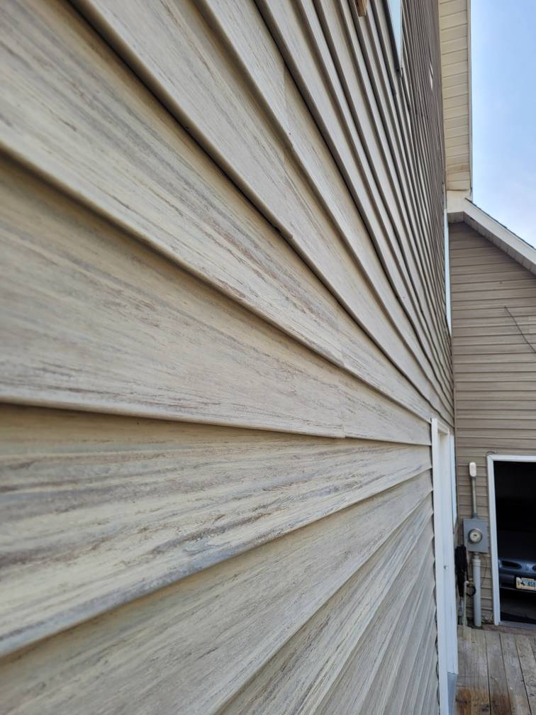 Vinyl siding installed on the side of a home.