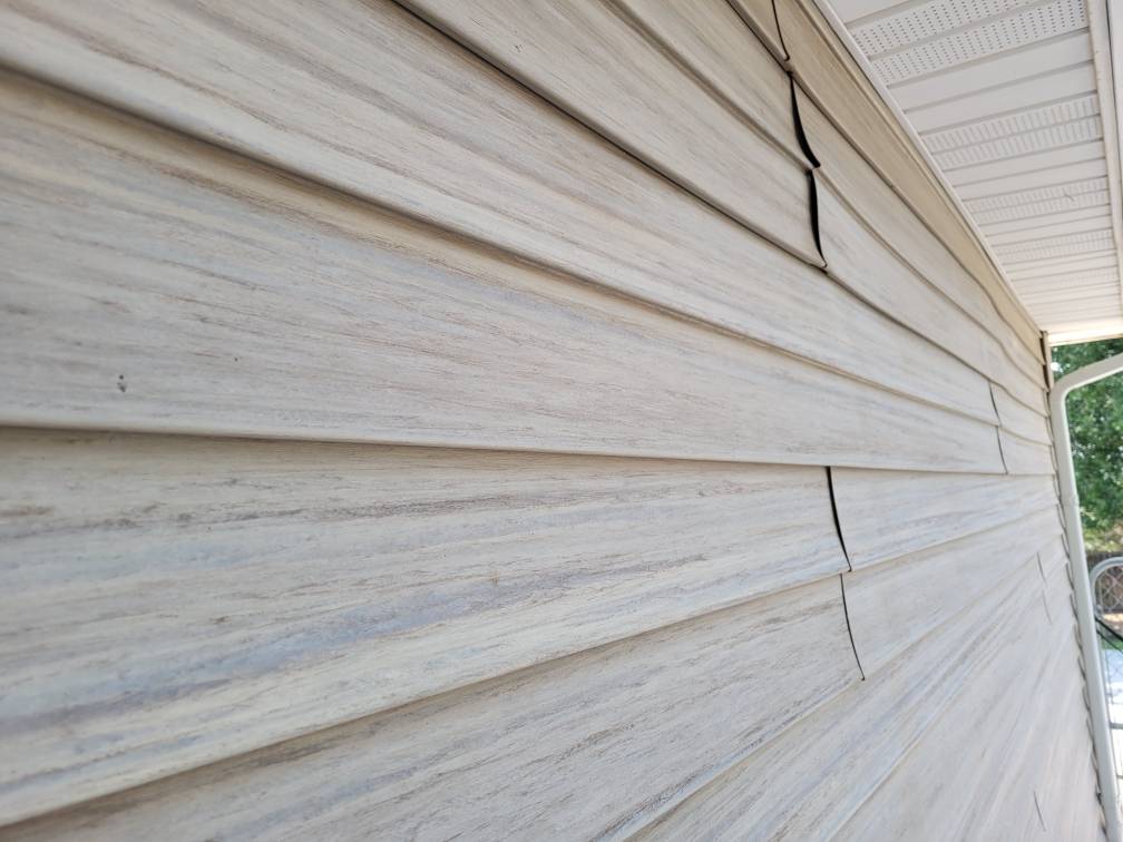 Vinyl siding with seams showing since it's not staggered.