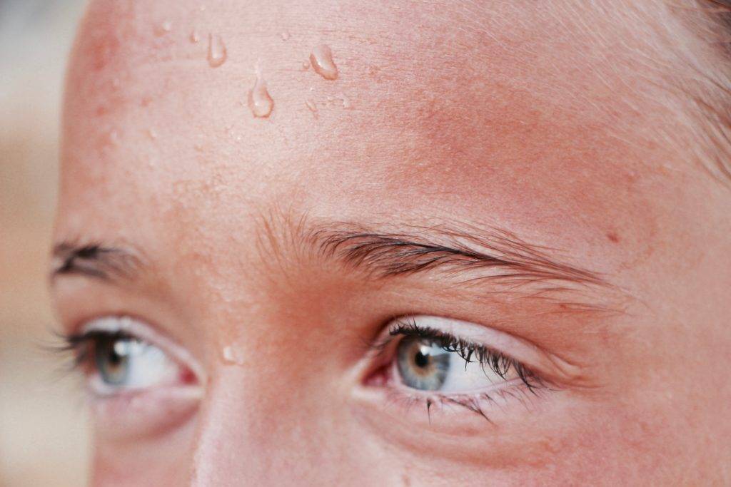 girl with sweat on forehead
