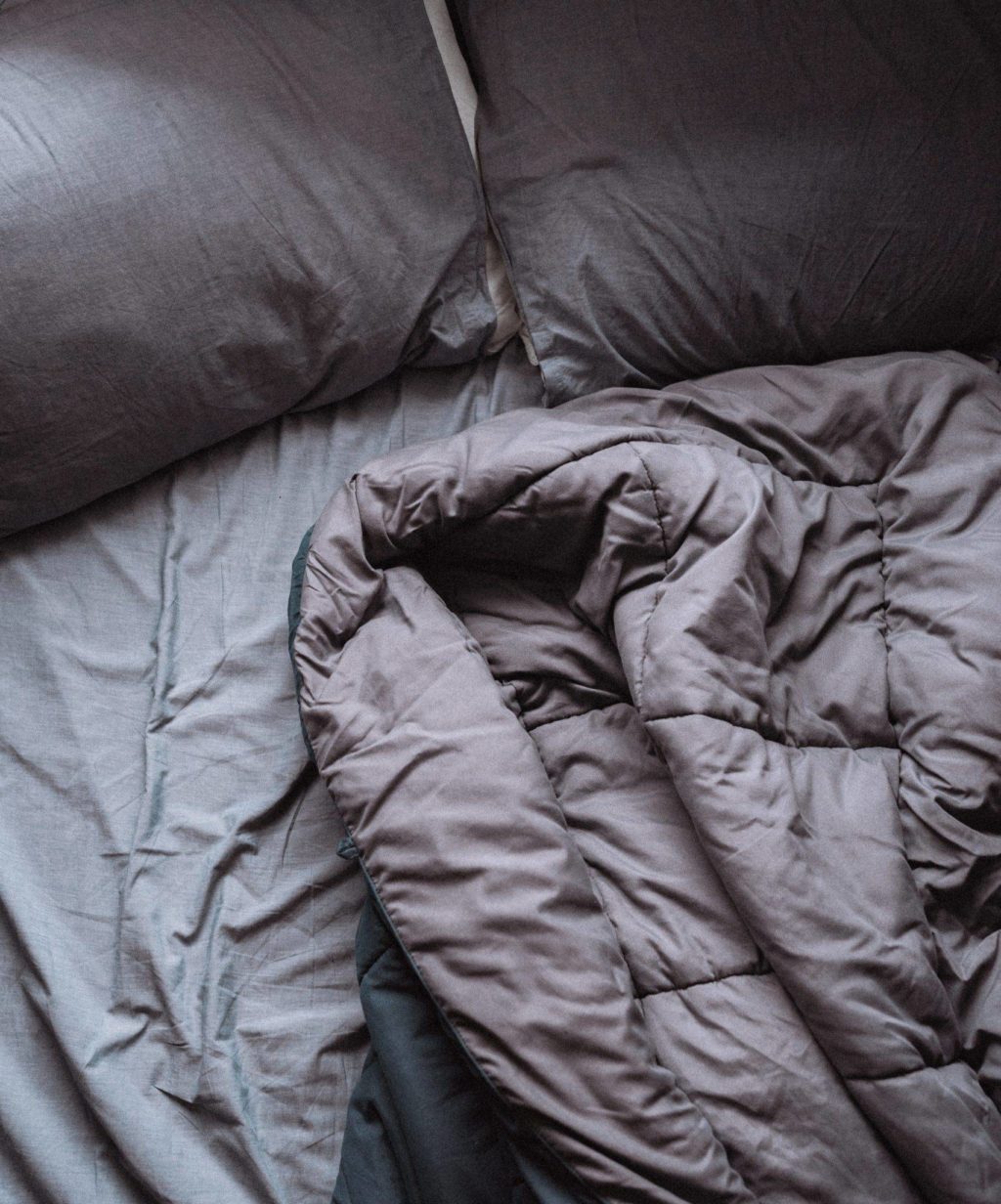 weighted blanket on top of a bed