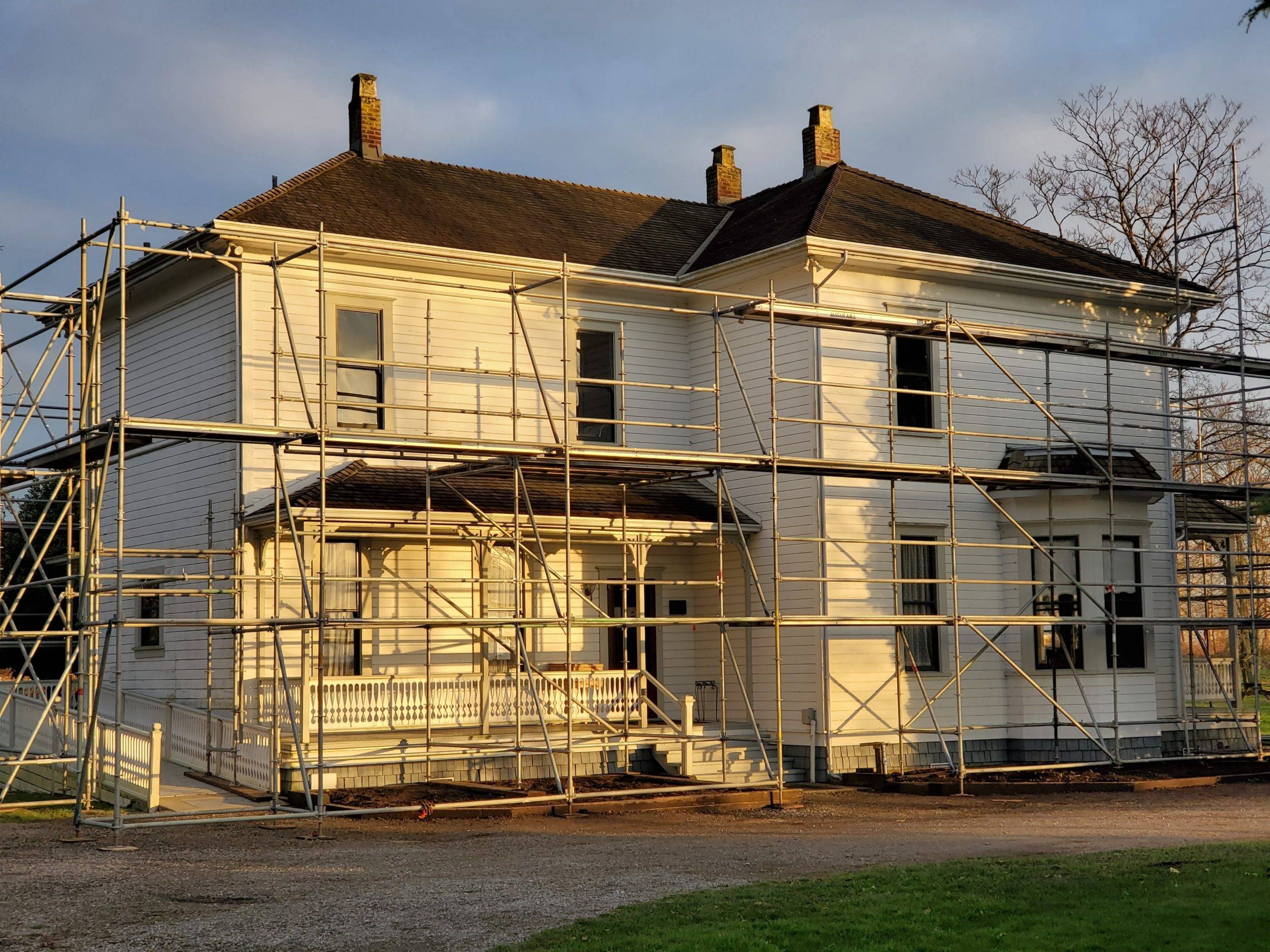 white wooden house with scaffolding