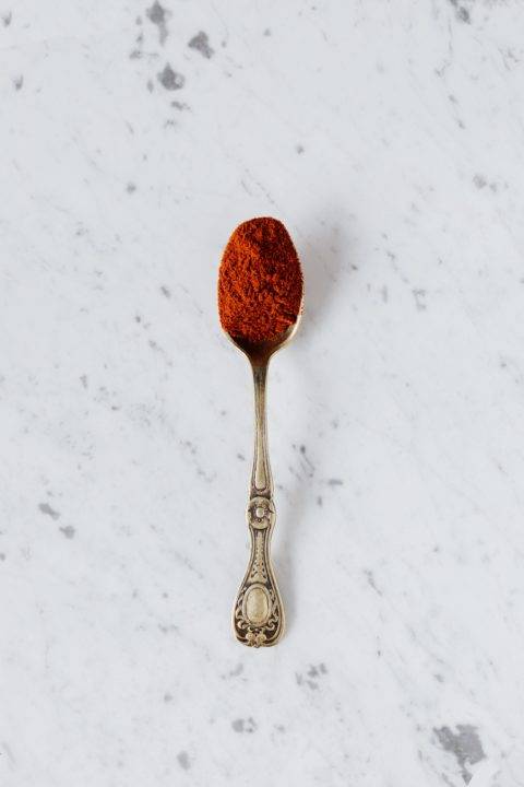 spoon with cayenne on quartz countertop