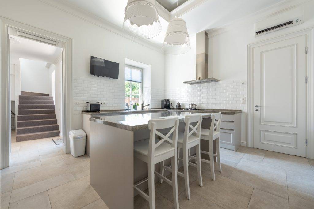 white and grey kitchen with quartz countertop island