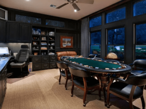 man cave with office and poker table