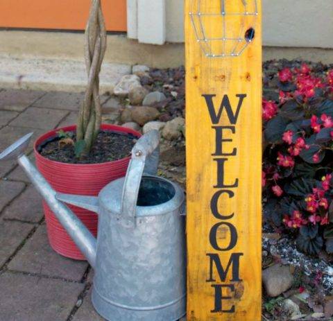 welcome sign made of pallet wood