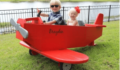 red wooden toy airplane