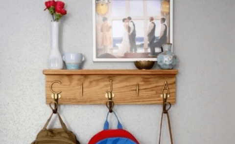 wooden entryway shelf with hooks