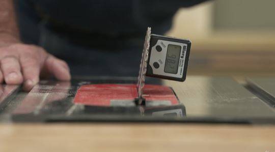 man using a table saw