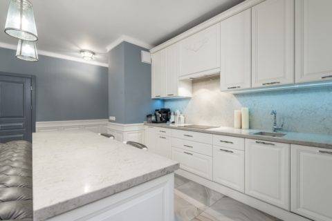 kitchen with white cabinets and a granite countertop