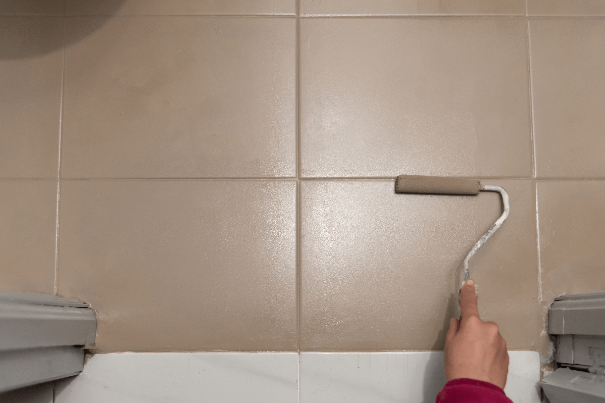 hand painting brown tile with roller