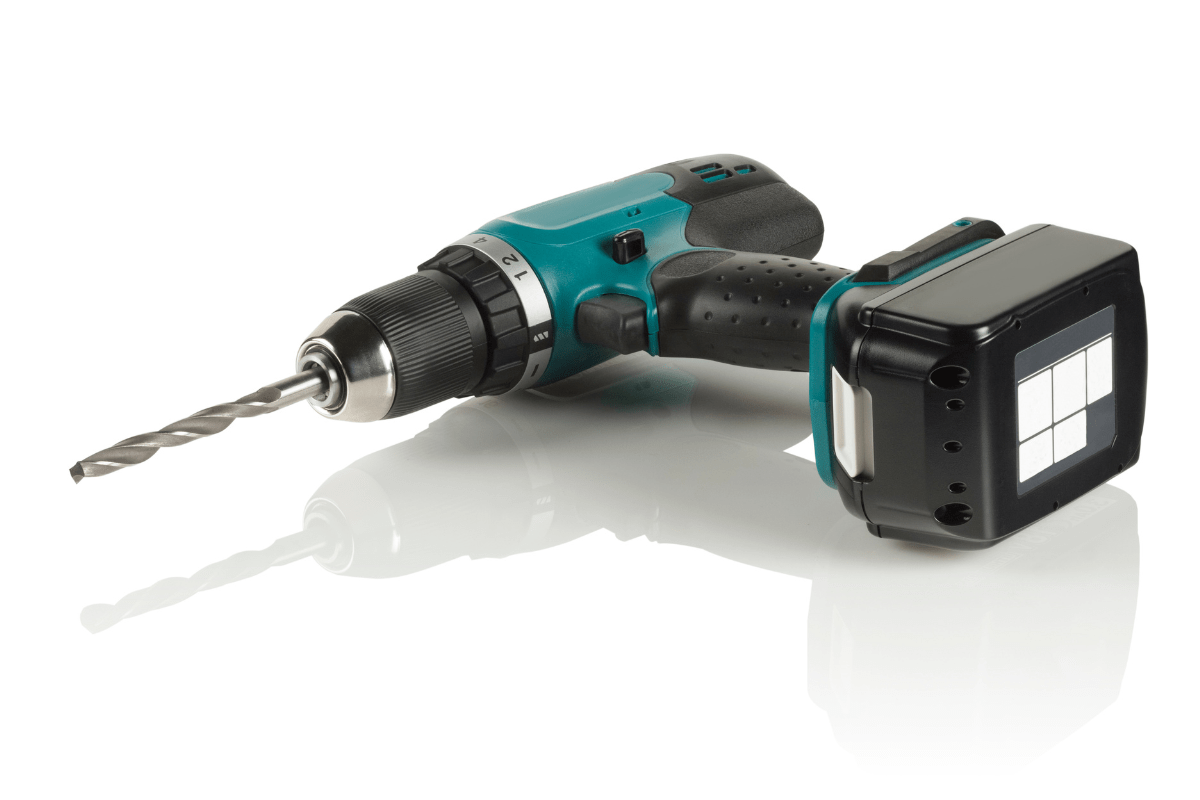 cordless green drill on white background
