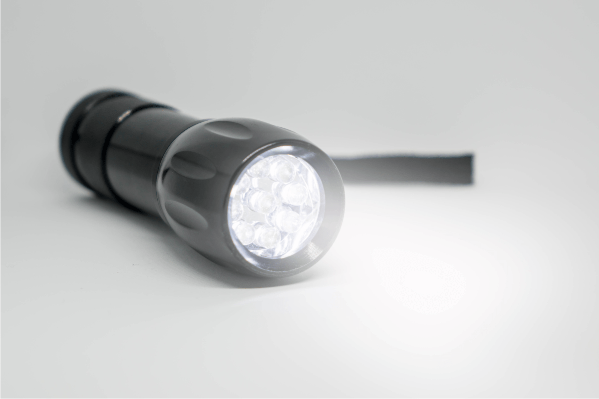 black flashlight on white background