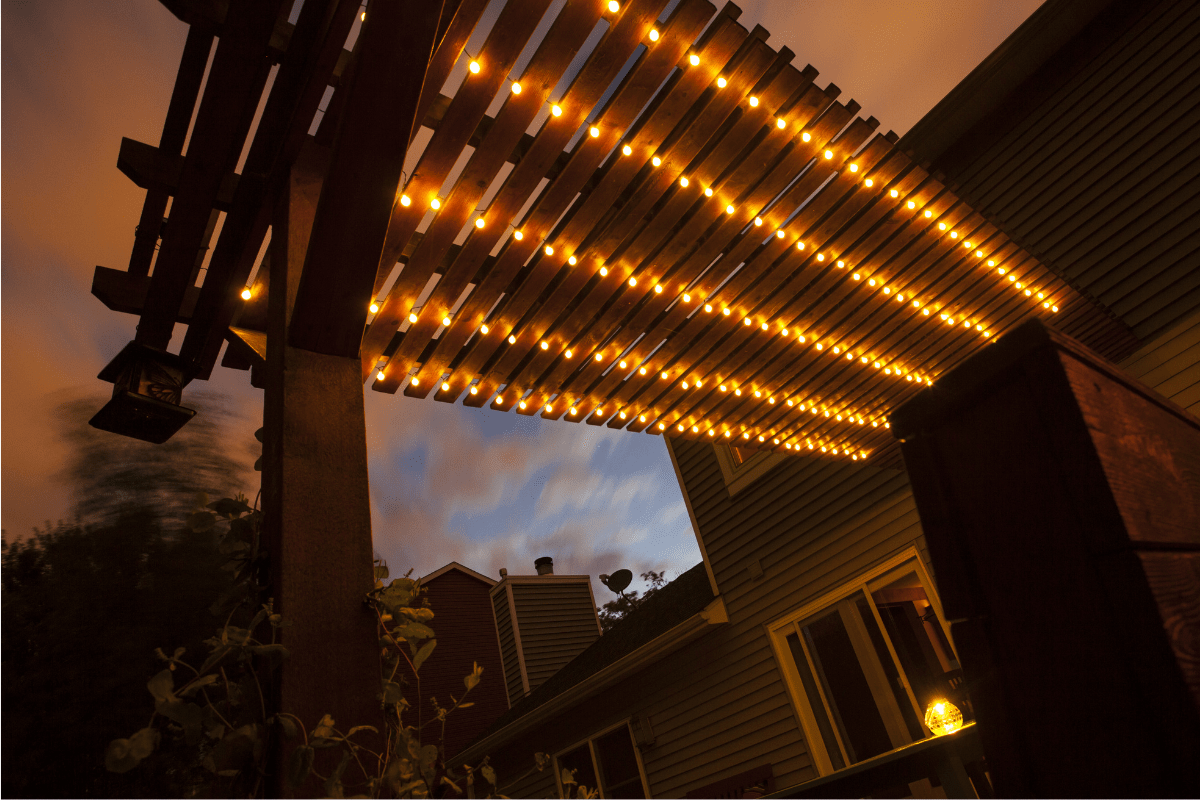 string lights on pergola at night