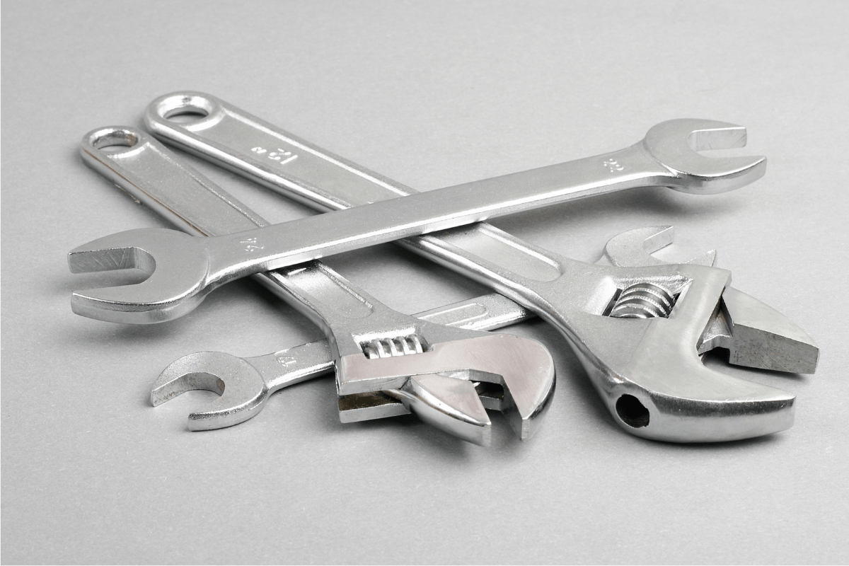 adjustable wrench on grey background