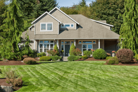 large front of house on perfect landscape lawn grass just cut