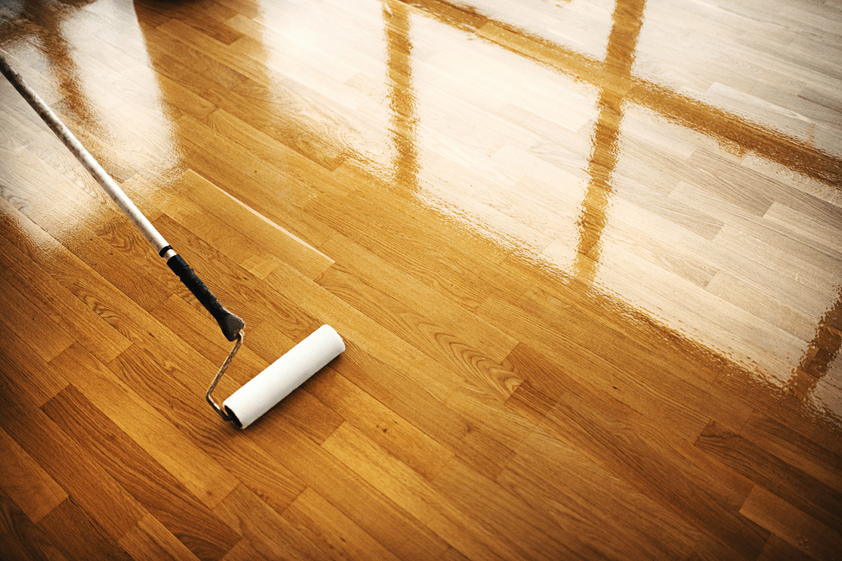 shiny hardwood floor with paint roller