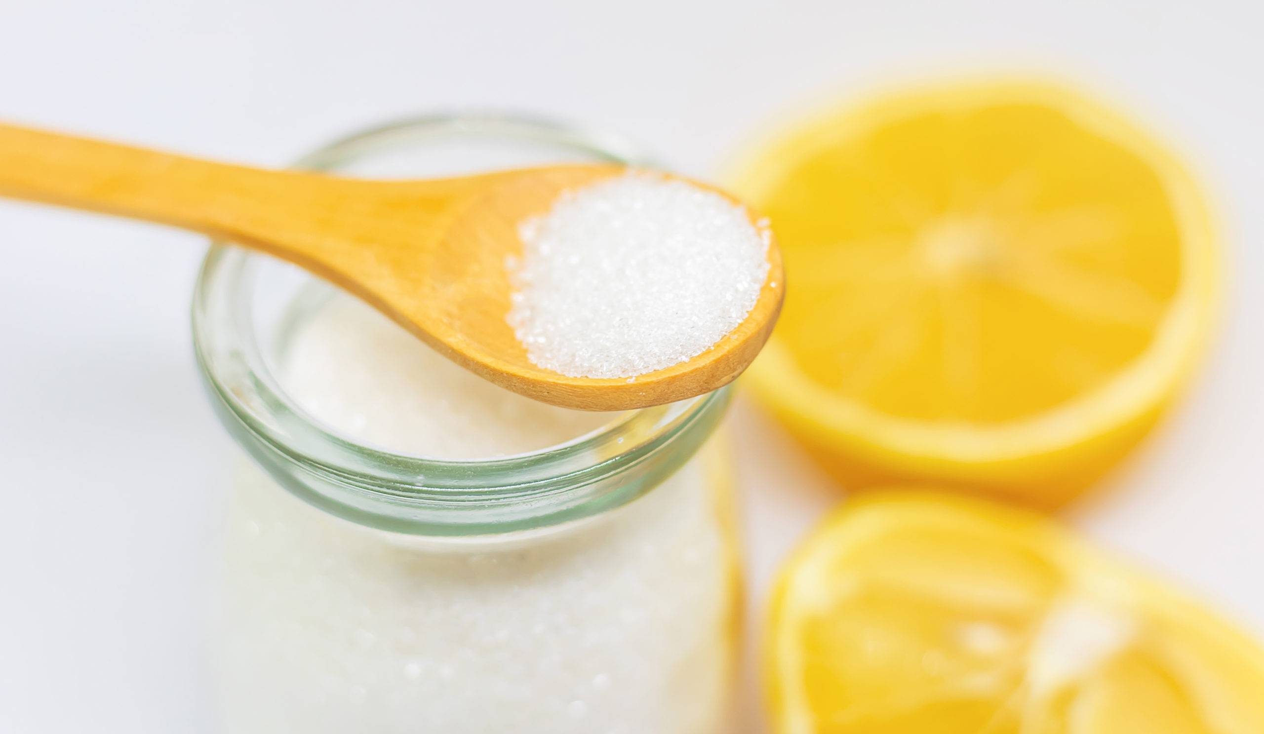 Citric acid on a white isolated background. Selective focus. Food.
