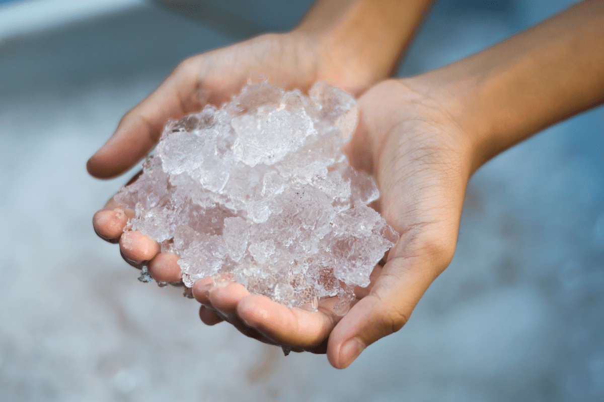 close up of hands holding ice