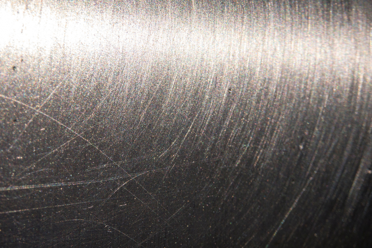 close up of small scratches on stainless steel