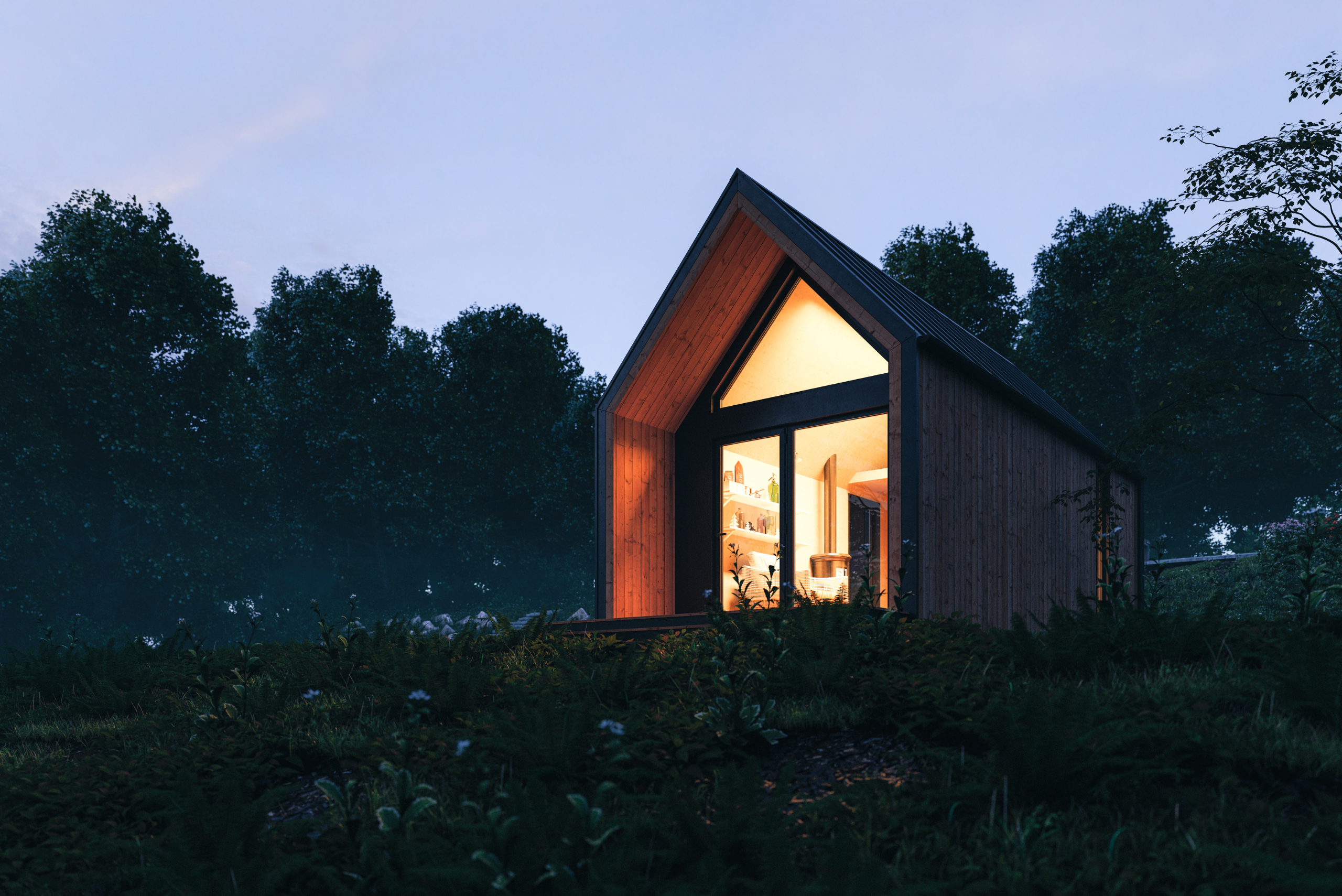 Tiny home at night with its lights on illuminating through the windows.