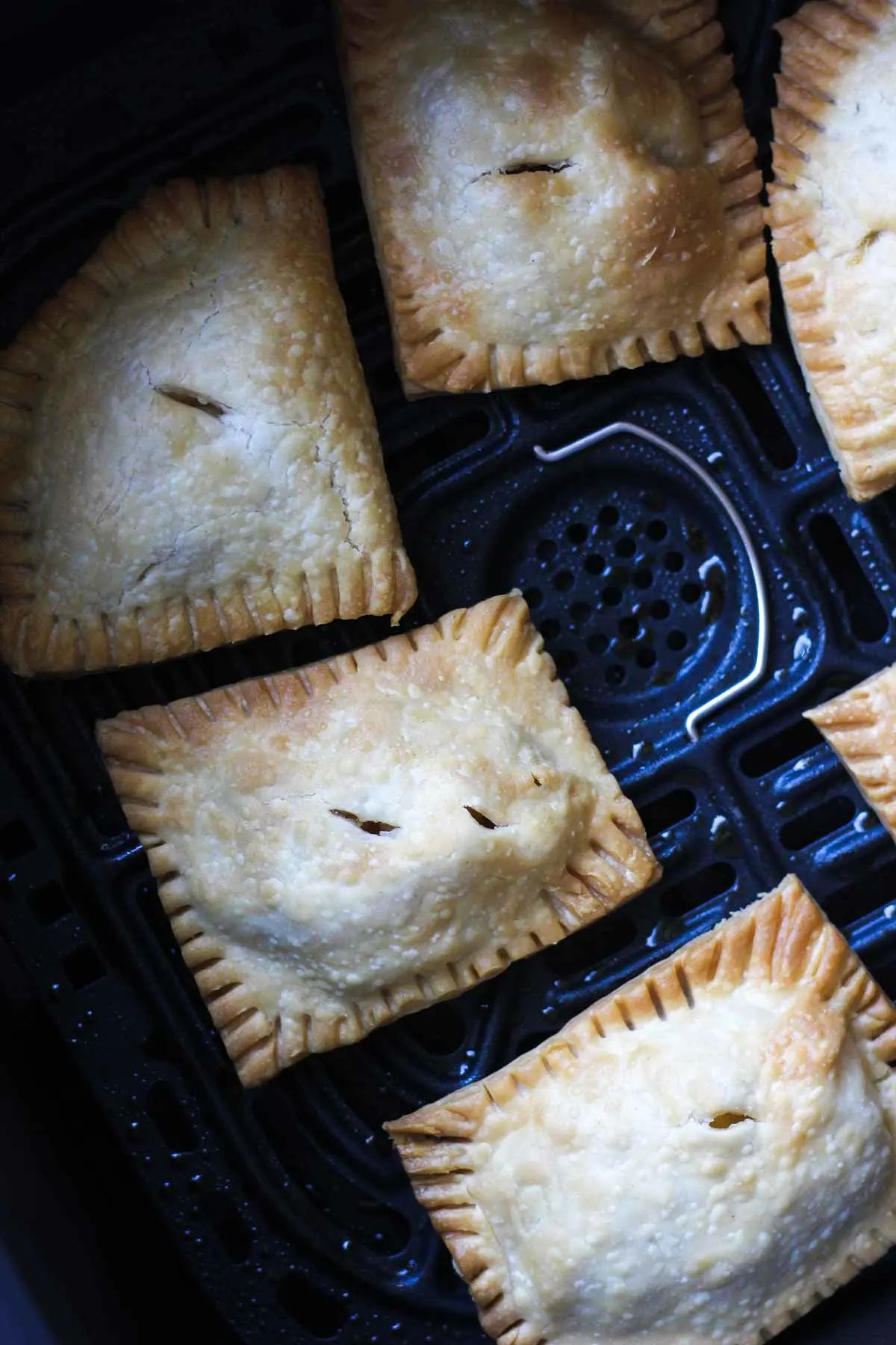 mini apple pie pastries in air fryer bin