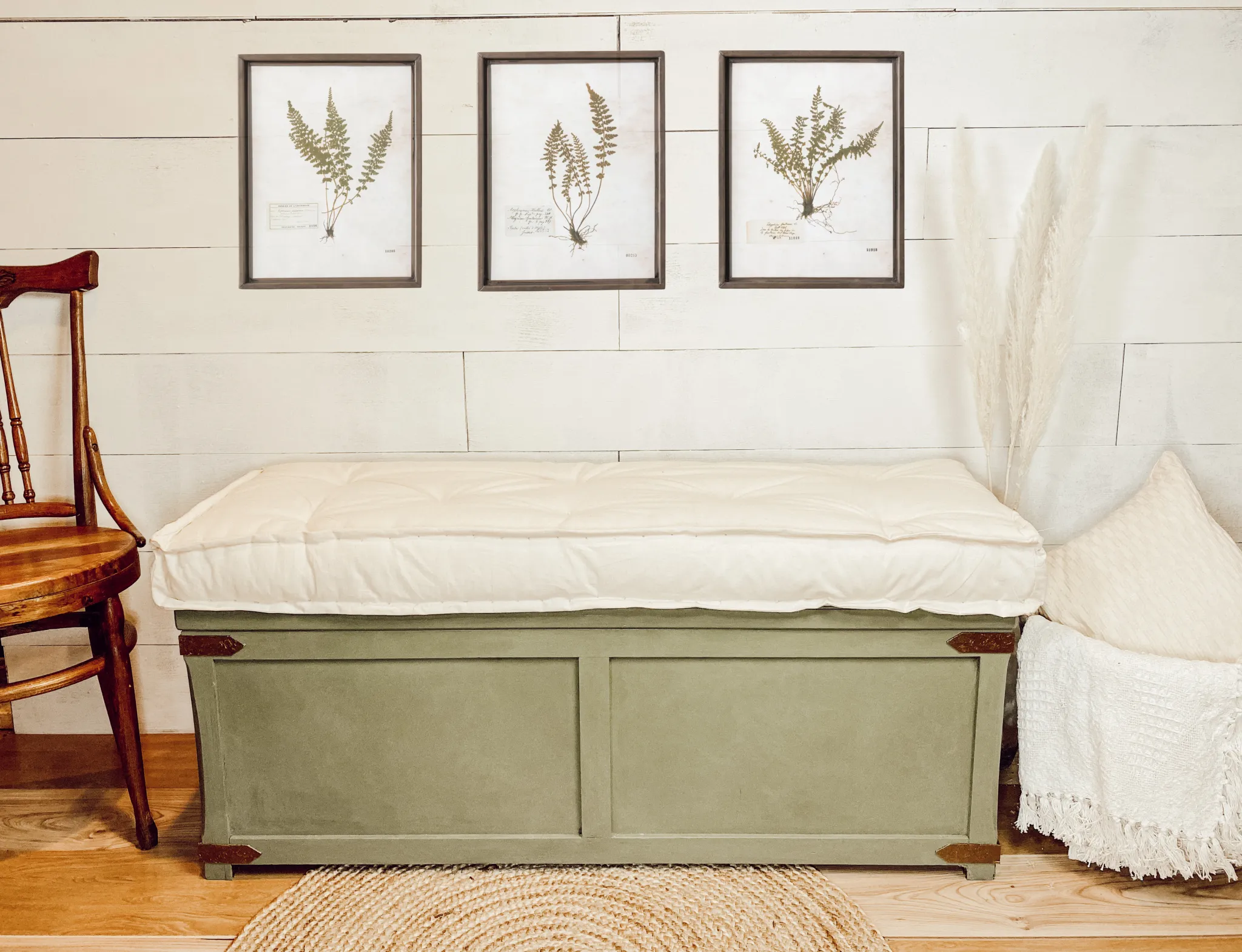 wooden chest bench covered in green suede with white cushioning