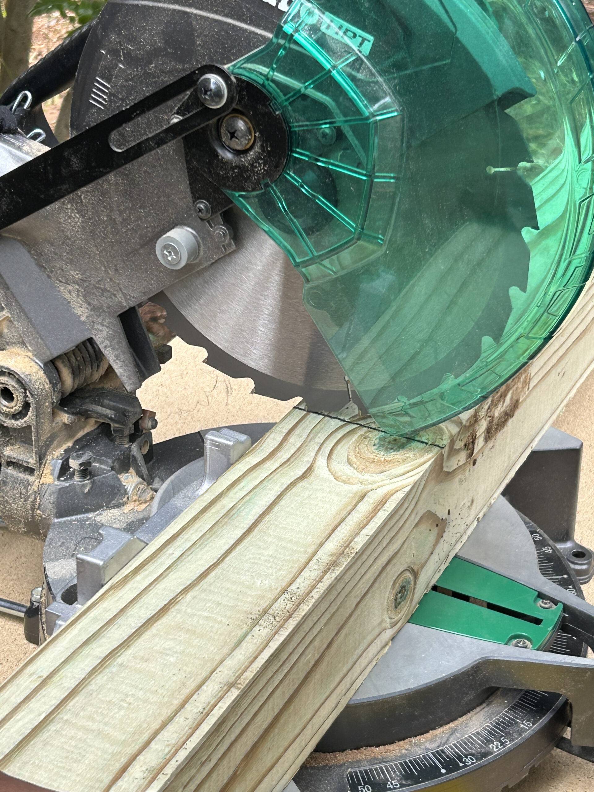 miter saw cutting wood piece