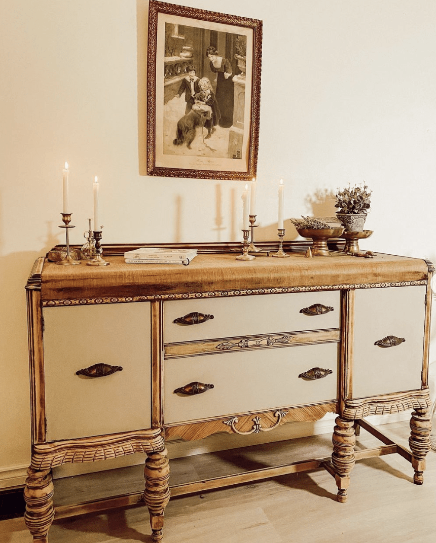vintage wooden hutch with candle sticks and decorative accents