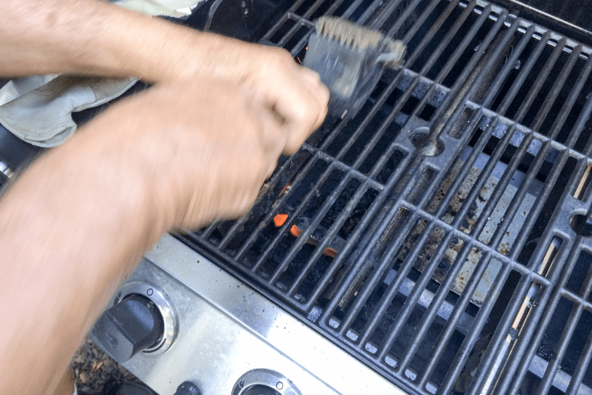 close up of a bbq being cleaned