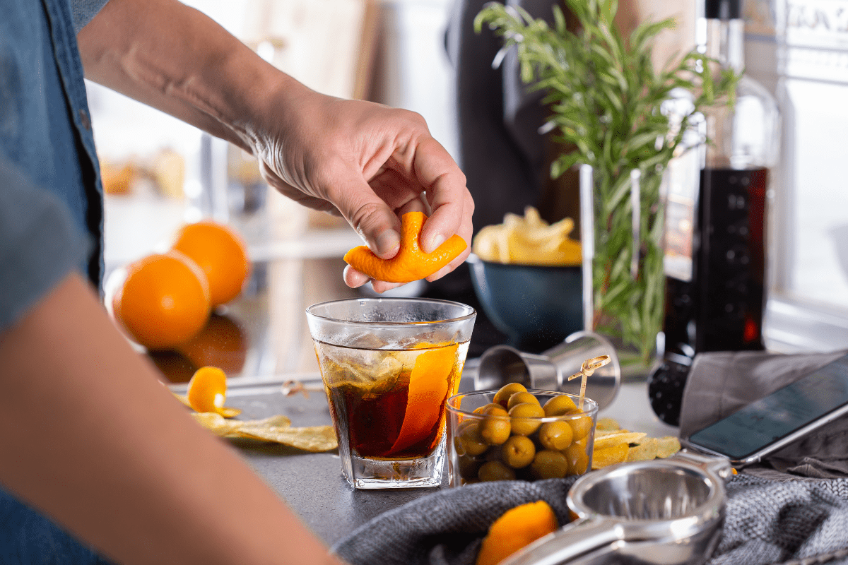 making a drink at home with an orange peel