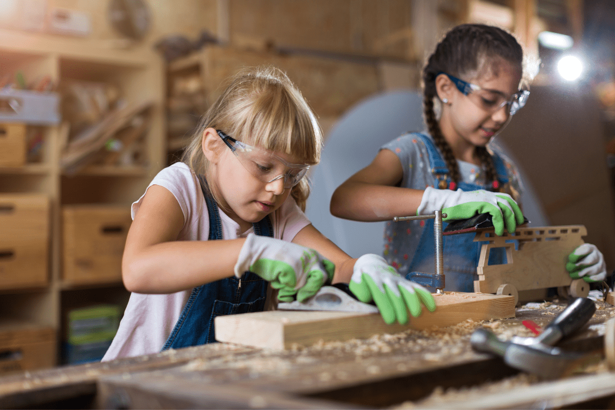 two girls working with wood
