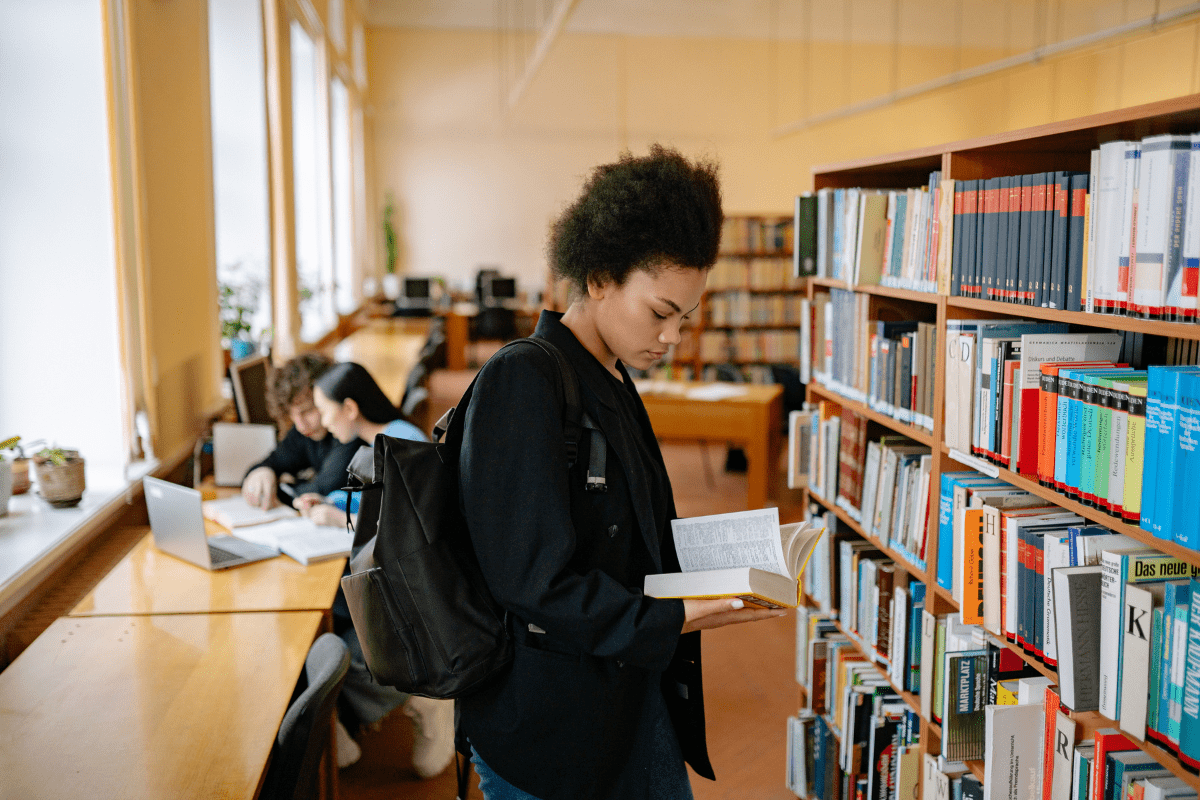 woman reading at library