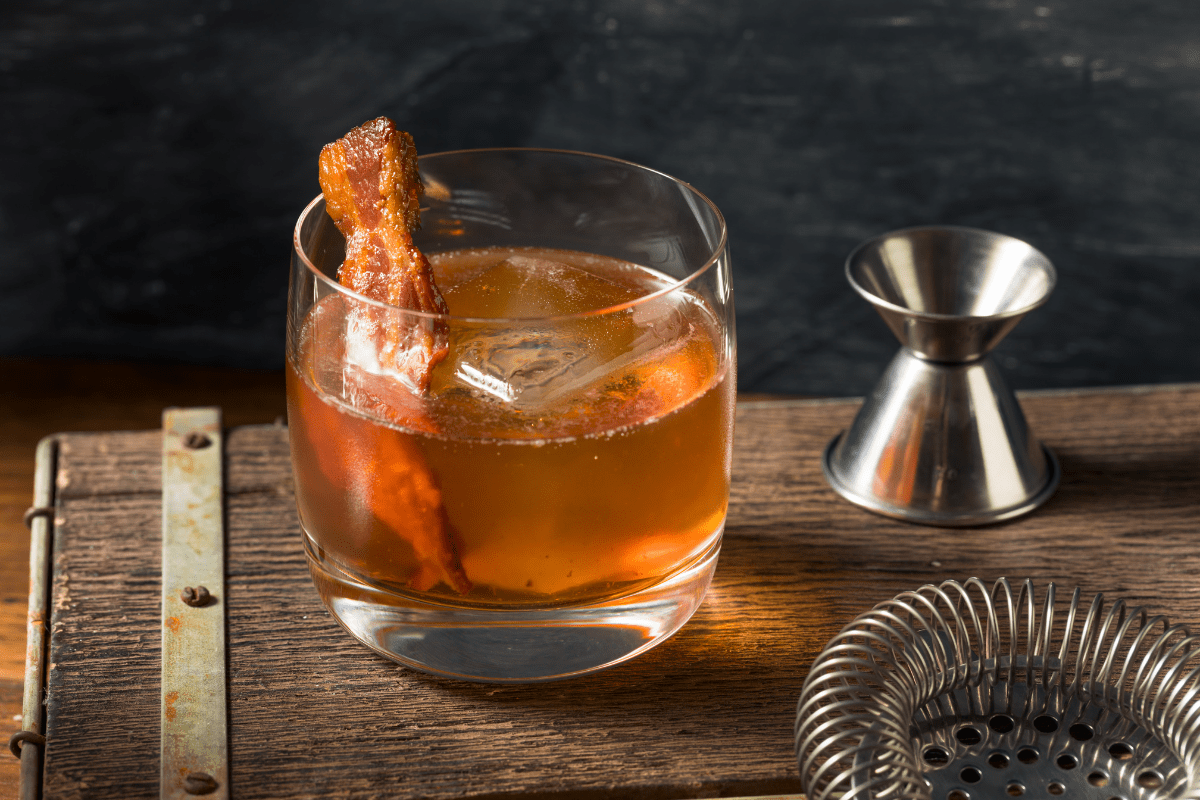 spiced maple bacon bourbon on wood background