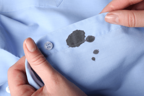 oil stains on blue shirt
