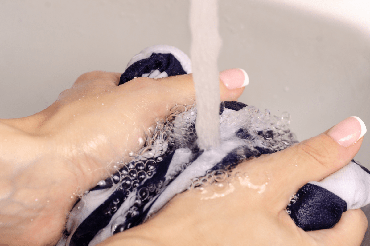 washing clothes under water.