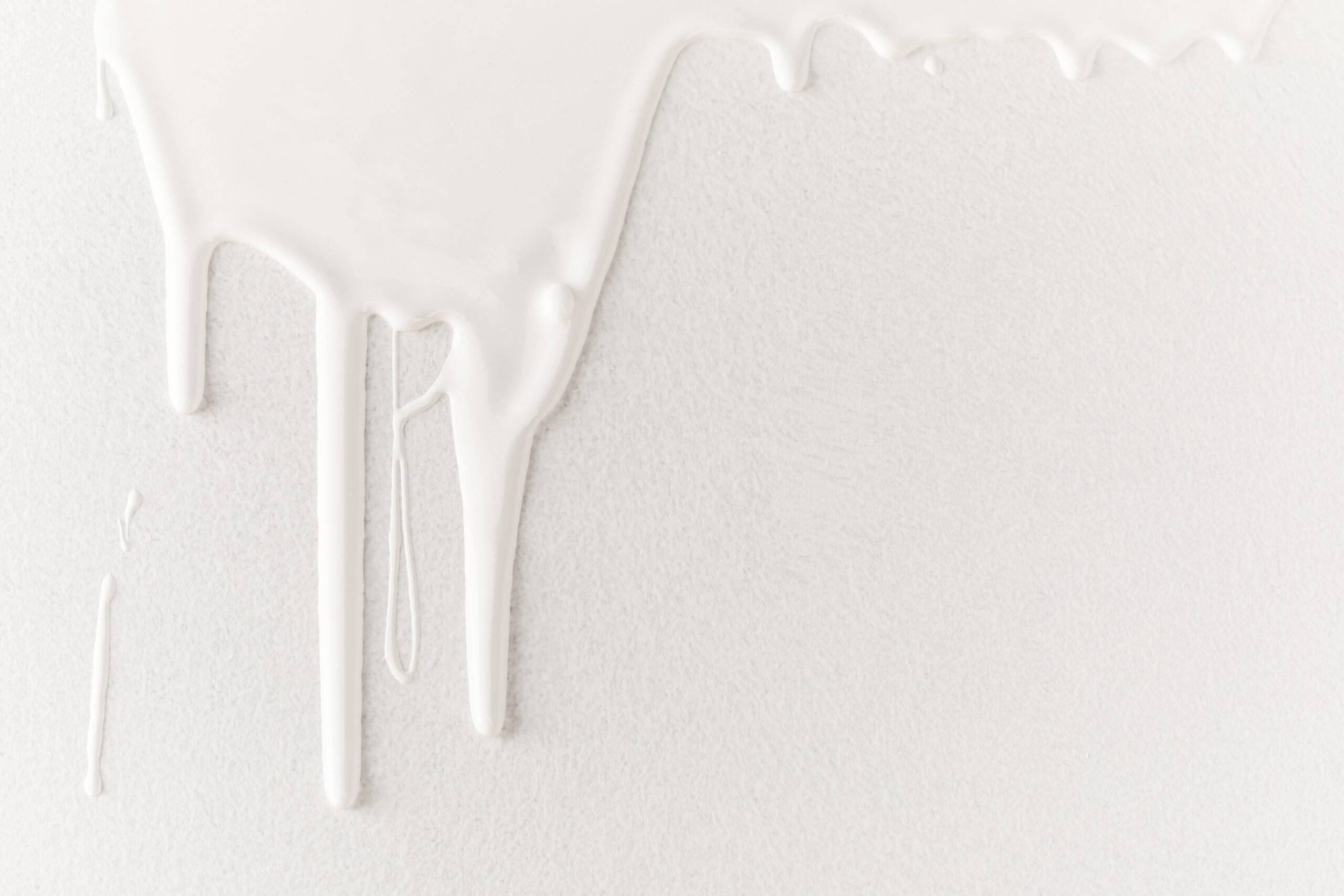 white dripping paint on white surface