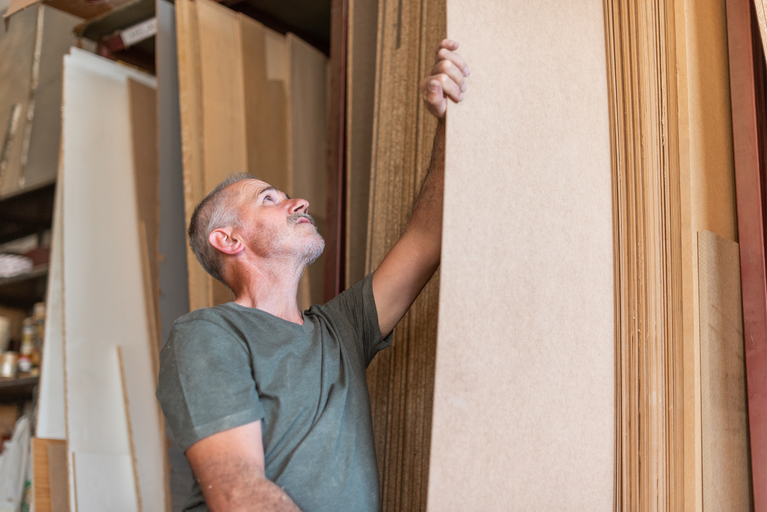 Worker selecting a MDF board sheet